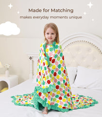 DREAMHALO Apple blanket in a cozy nursery scene with breathable fabric.