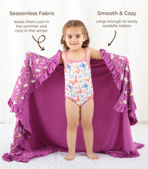 DREAMHALO purple unicorn blanket shows swaddle-use versatility for snug, calming naps.
