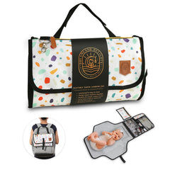Dreamland Delights cute print changing pad in use with wipes pocket for easy baby changes