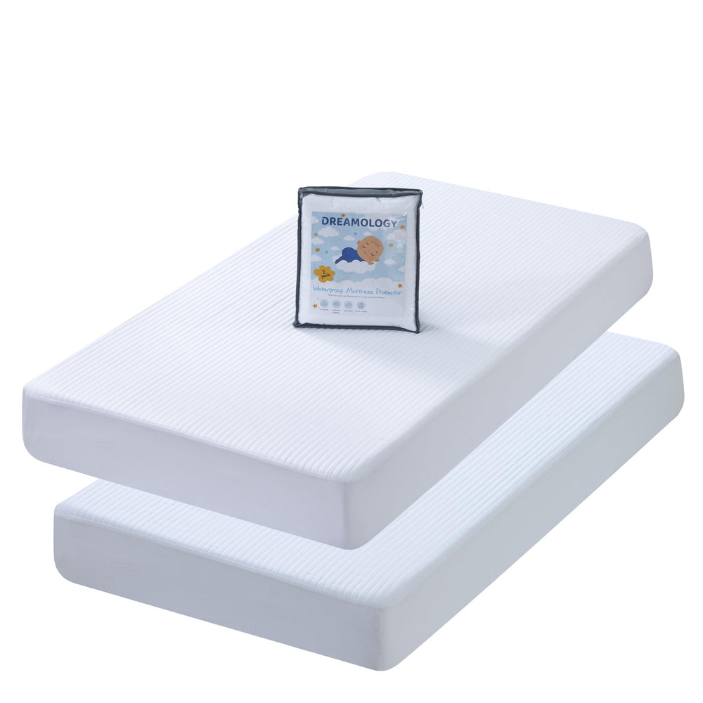 Dreamology mini crib protector close-up showing quilted top and soft texture for spills protection.