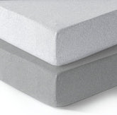 Dreamology mini crib fitted sheet in soft cotton close-up highlights skin-friendly comfort.