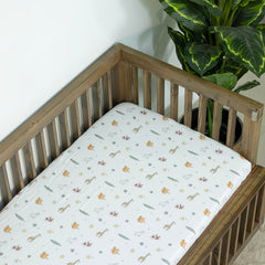 Dreamology muslin crib sheets on a toddler bed illustrate easy transition bedding.