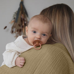 Dreamology muslin swaddle blanket soft close-up showing ultra-soft breathable cotton.
