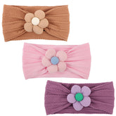 DRESHOW BQUBO baby flower headband closeup shows soft nylon for gentle wear
