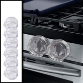 Driddle 6-pack clear stove knob safety covers installed on an oven knob for childproofing.