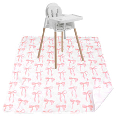 Drydiet Baby Splat Mat pink bow under high chair protects floors from spills.
