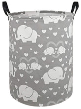 DUYIY round laundry hamper with handles for easy transport.