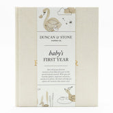 Duncan & Stone Baby First Year Book cover in cream highlights heirloom-quality design for cherished milestones.