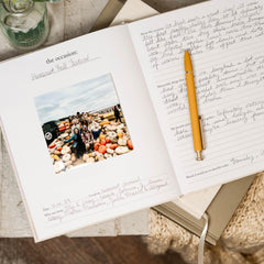 Duncan & Stone memory book 30 occasions layout captures milestones and photos.