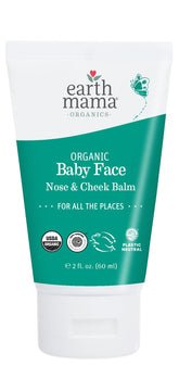 Earth Mama Organic Balm tube soothing a baby's dry cheeks