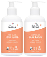 Earth Mama Sweet Orange Baby Lotion bottle on table, gentle daily moisture.