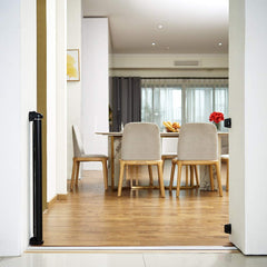 EasyBaby retractable gate installed indoors for safe passage between rooms.