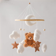 EERKEOD baby crib mobile bear closeup shows soft teddy velvet for gentle visual stimulation