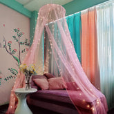 Eimilaly bed canopy pink mosquito net draped over a bed for a princess-like space.