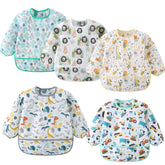 ElecMotive long sleeve bib on a child during mealtime protects clothes.