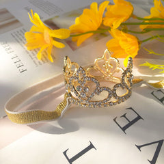 ELEMIRSA baby crystal crown gold detailed stones highlight tiny smiles in photoshoots.
