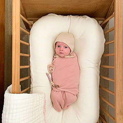 Ely's & Co adjustable swaddles mauve pink star fabric close-up highlighting breathable cotton