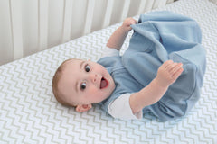 Ely's & Co. Baby Wearable Blanket blue solid sleep sack provides soft comfort and quick diaper access.