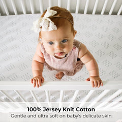 Ely's & Co. fitted sheet shows secure elastic-fit band for snug playard fit
