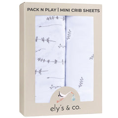 Ely's Co Pack N Play sheets folded with forest grey floral pattern for cozy naps