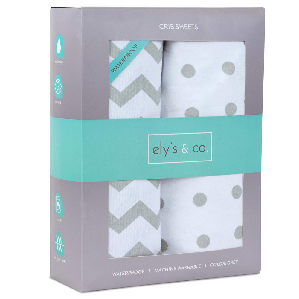 Ely's & Co waterproof crib sheet close-up shows elastic band for secure snug fit.