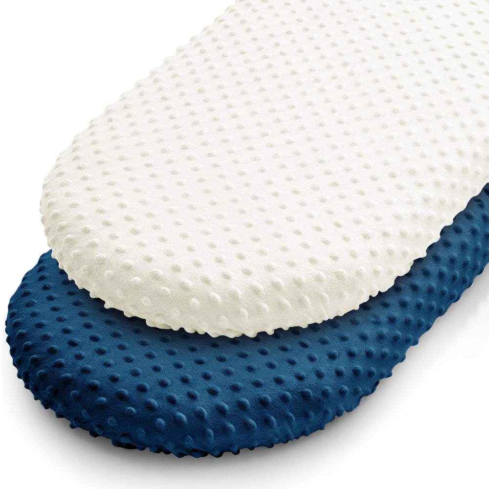 Entisn bassinet sheet set in navy dot design offers a soft, cozy sleep surface.