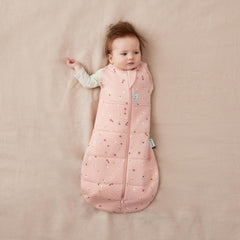 ergoPouch Cocoon Swaddle Sack daisies arms-out with shoulder snaps supports versatile sleep positions
