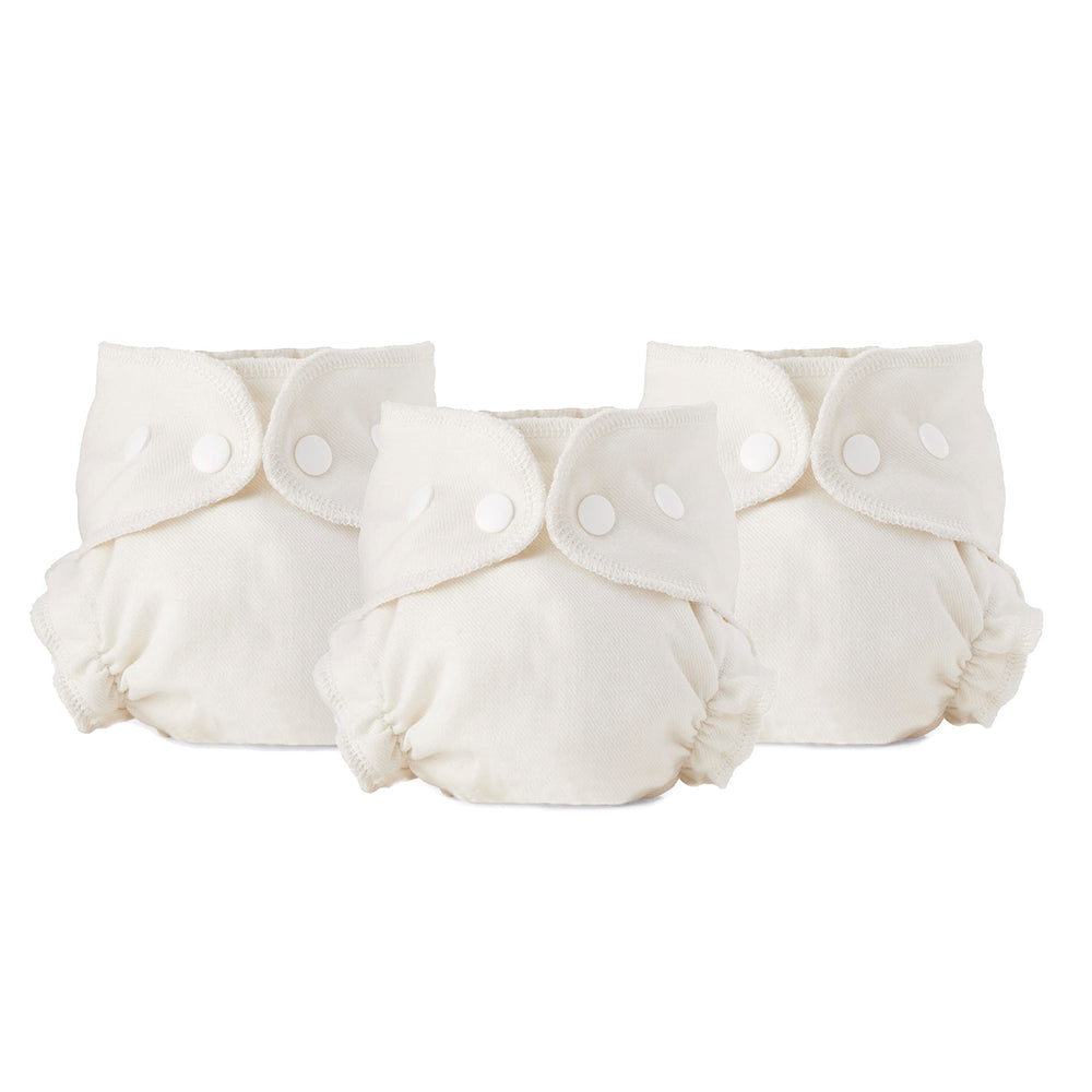 Esembly cloth diaper inner close-up of the soft absorbent butterfly-core for leak protection.