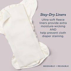 Esembly Stay-Dry liner being washed with diapers on laundry day.