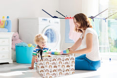 Essme rainbow-pattern basket in living room, great for quick toy cleanup after playtime.