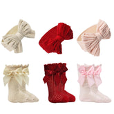 Esumun baby socks with bows, soft knit for newborn comfort and photos.
