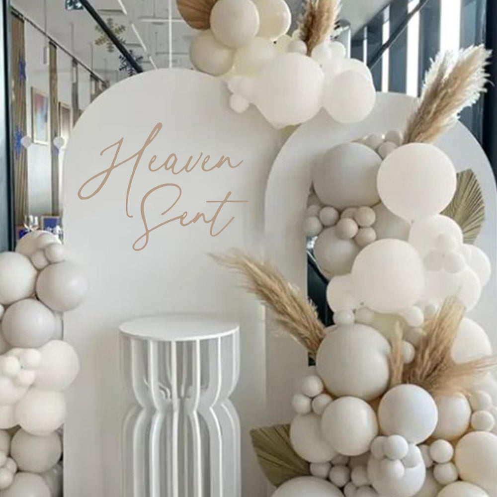 Eurteka Heaven Sent Decal wall application enhances baby shower decor with refined lettering.