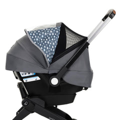 Evenflo Shyft DualRide All-Weather Cover installed on stroller for 360° protection