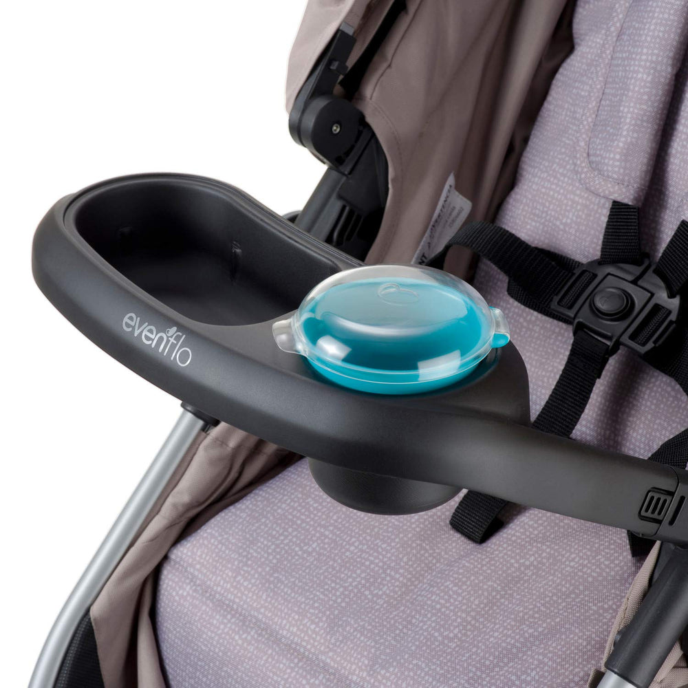 Evenflo stroller snack tray angled view aids easy finger foods.