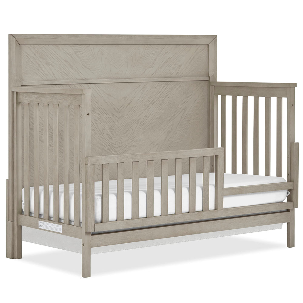 Evolur Lourdes guard rail on Porcini crib offers easy assembly for a secure toddler transition
