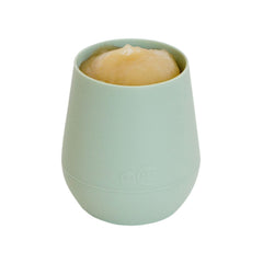 ezpz Tiny Cup Sage weighted-base image shows topple resistance during use.