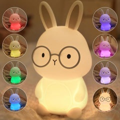 Famiduo bunny night light glowing softly on a kid's bedside table for bedtime comfort.