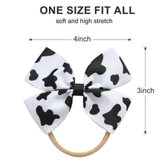 Fancheer cowprint bow close-up shows soft ribbon texture and gentle elastic