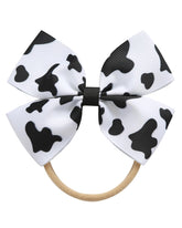 Fancheer cowprint cowgirl bow headband worn on infant for cute photo prop