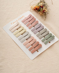 Fancy Clouds alligator clips with linen wrap for gentle, safe grip.
