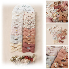 Fancy Clouds baby hair ties with 2in linen bows closeup highlights soft texture and gentle hold