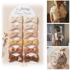 Fancy Clouds daisy bows 12pcs image shows earthy tones and gentle hold for kids
