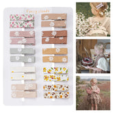 Fancy Clouds flower-pattern clips with fabric lining provide secure grip for all ages