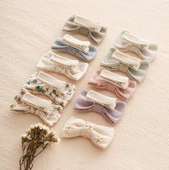 Fancy Clouds linen-wrapped clip closeup with safe, gentle contact on tiny scalps