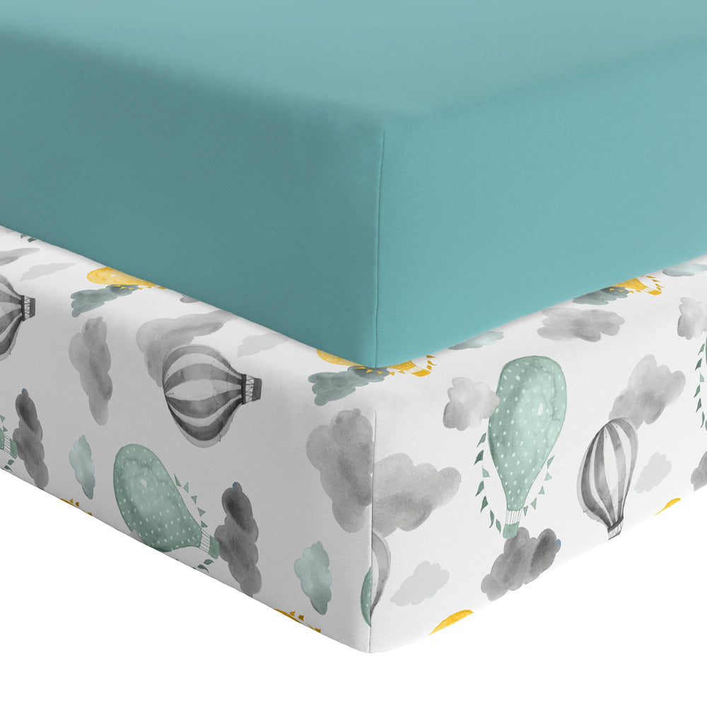 Featherhead 2-Pack Fitted Crib Sheets with percale green balloons provide soft touch and secure fit