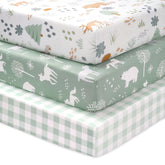 FIEMOL Green Forest Bear sheets folded showing ultra-soft microfiber texture for gentle baby skin