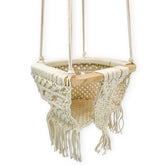 Finn + Emma baby swing with solid wood bar for a sturdy, soothing nursery accessory.