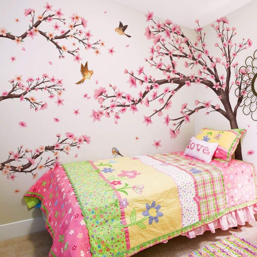 Finpletai cherry blossom tree wall stickers on a wall create a playful girls room ambiance.