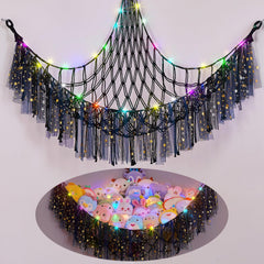 FIOBEE stuffed animals hammock with LED light brightens a nursery corner.