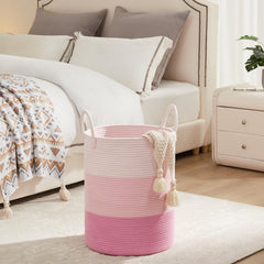 Fiona's magic pink nursery organization hamper shows versatile storage for baby blankets and toys.